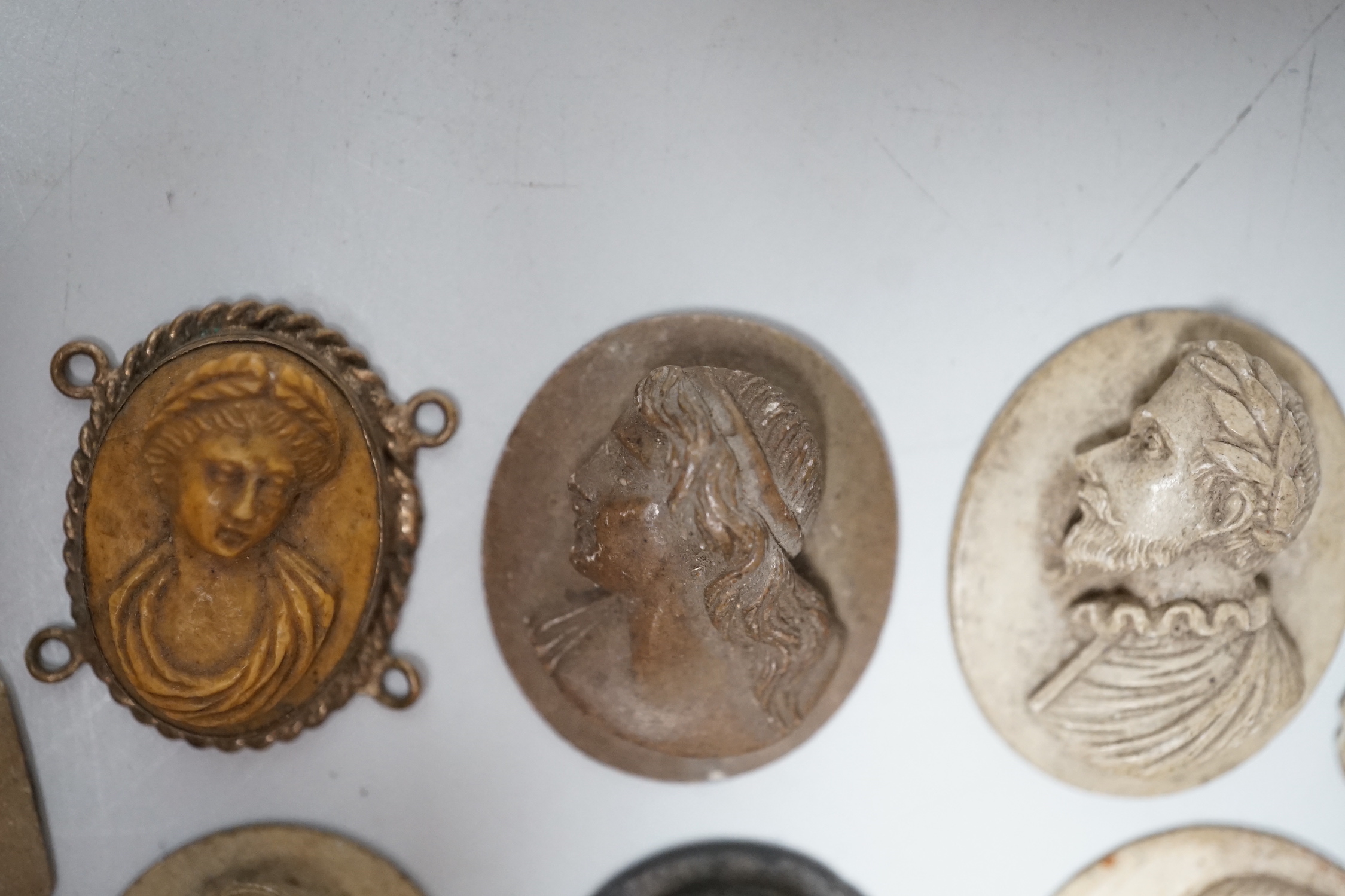 A group of eight lava stone roundels